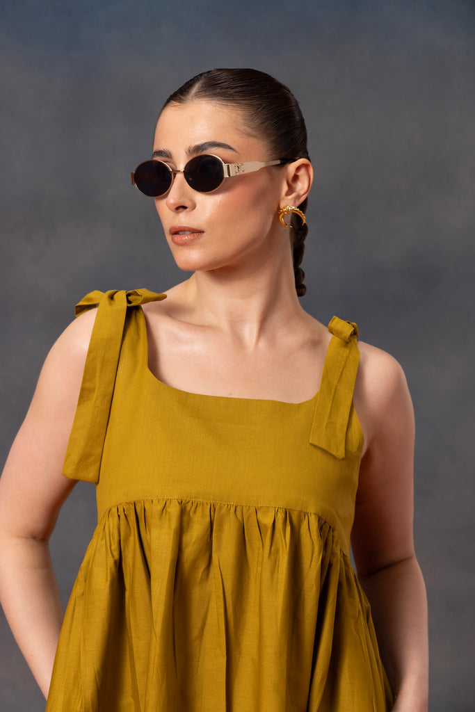 Lime Green color sleeveless Midi Dress with blue floral patch on the dress along with sqaure neck detailing 