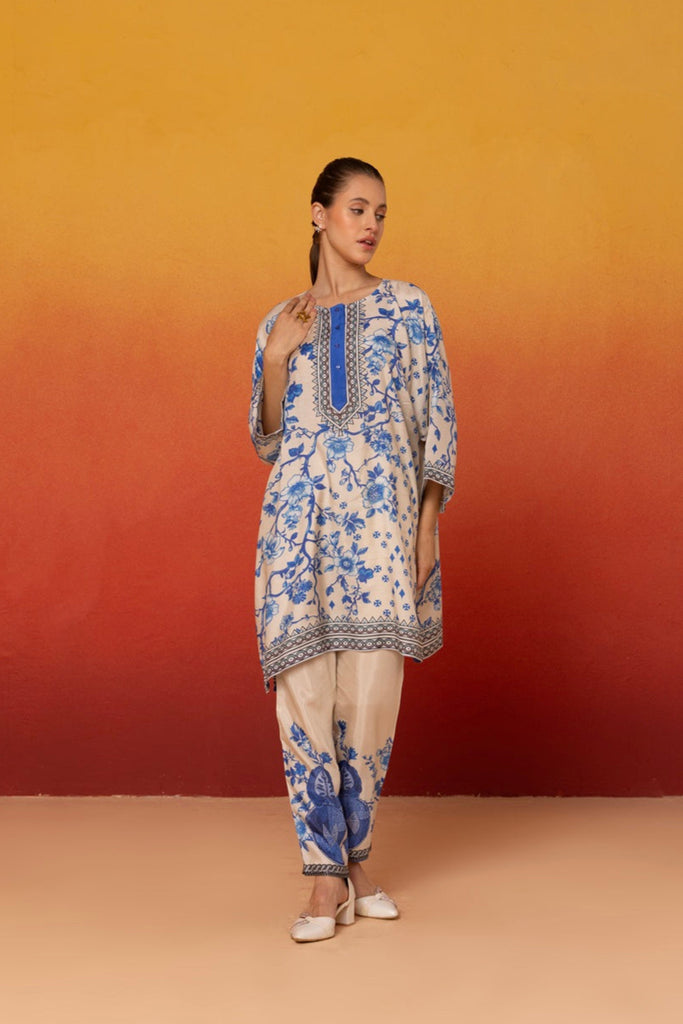 Blue and white floral coord set with a round neckline and 3/4 sleeves along with matching pants