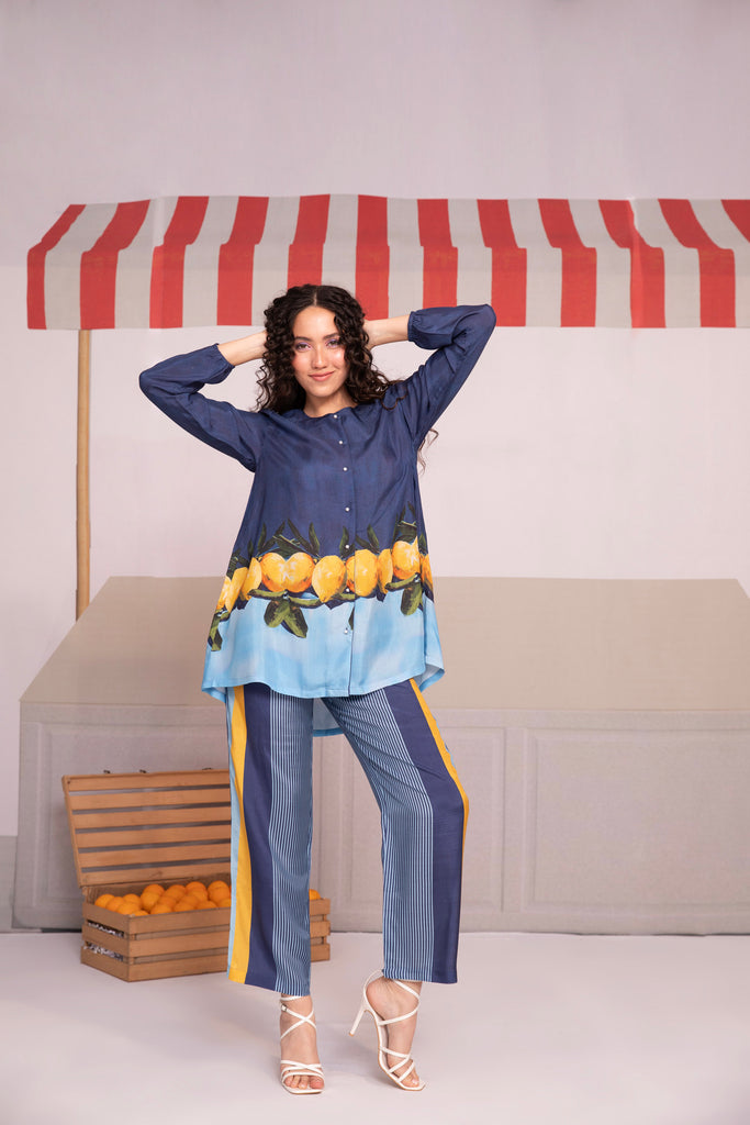 Blue color co-ord set with lemon prints, consisting of a top and stripped pants 