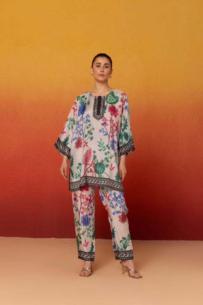 White and Multi Color Muslin Co-ord Set in floral print top along with matching pants